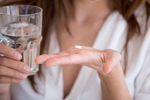 Lady prepares to take medicine