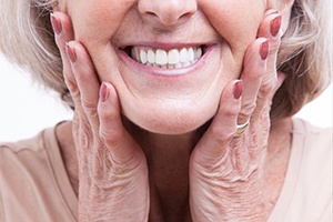 closeup of patient smiling after getting dental implants