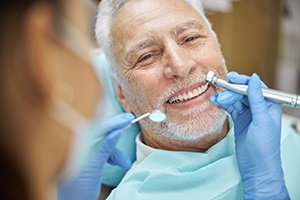 patient smiling after getting dental implants