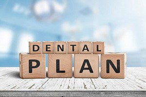 Blocks spell “dental plan”