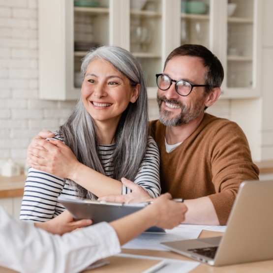 Couple listening to person across table