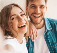 Young man and woman laughing together