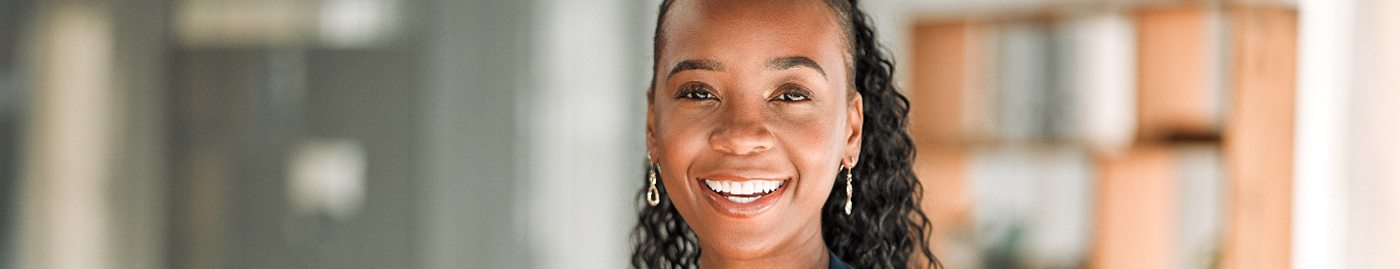 Smiling woman holding a tablet