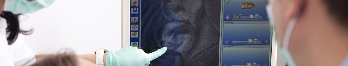 Dentist showing a patient a digital scan of their tooth