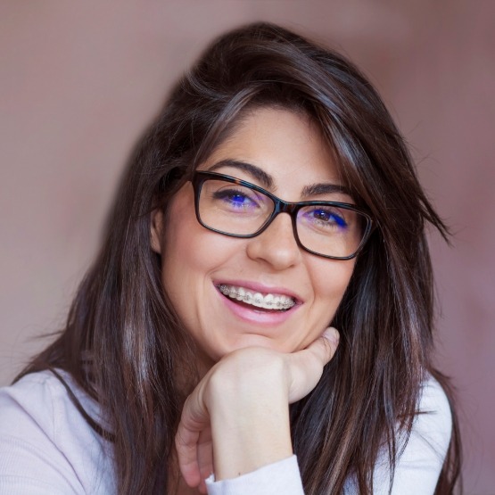 Smiling adult woman with braces