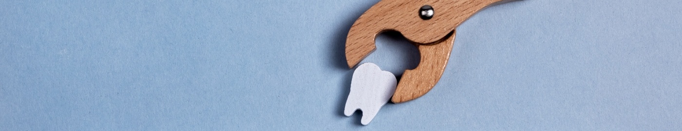 Illustration of wooden clasp extracting a wooden tooth
